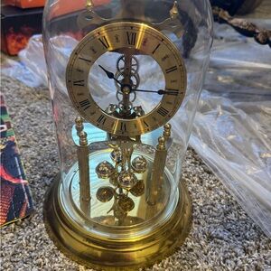 Elegant Brass Rotating Pendulum Clock